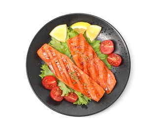 Photo of Tasty grilled salmon, lettuce, tomatoes and lemon isolated on white, top view