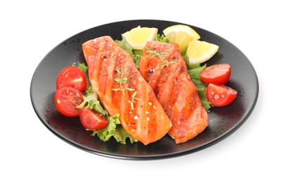 Photo of Tasty grilled salmon, lettuce, tomatoes and lemon isolated on white