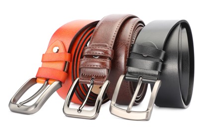 Photo of Three different leather belts isolated on white