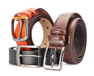 Photo of Three different leather belts isolated on white