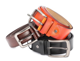 Photo of Three different leather belts isolated on white