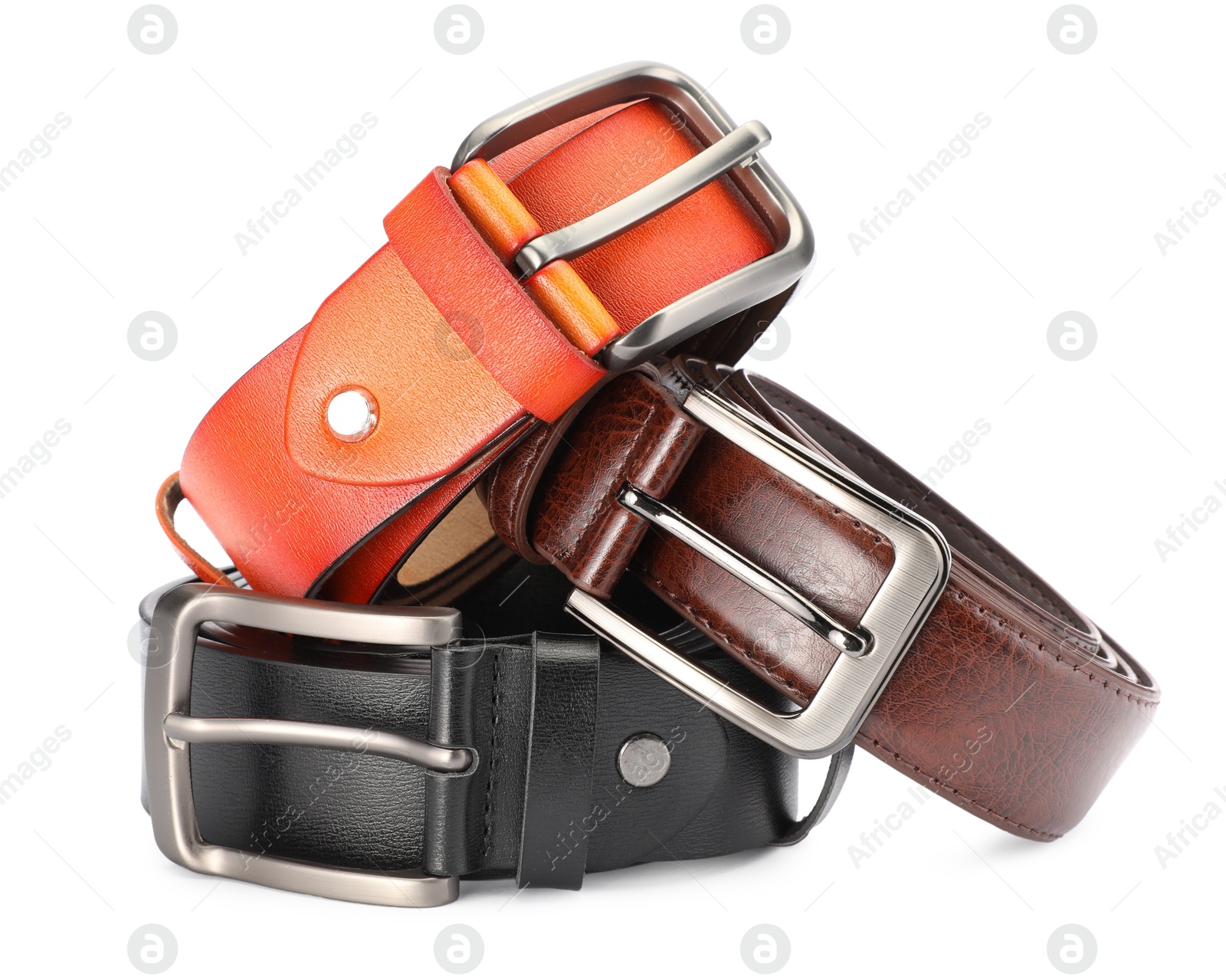 Three different leather belts isolated on white Photo of Three different leather belts isolated on white