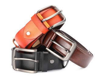 Photo of Three different leather belts isolated on white