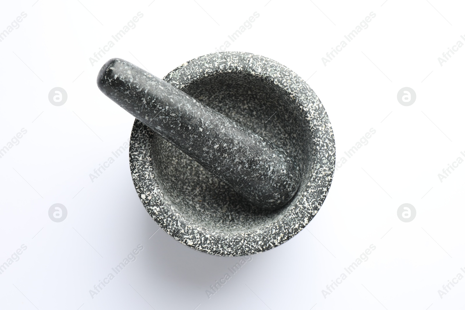 Stone mortar and pestle on white background, top view Photo of Stone mortar and pestle on white background, top view