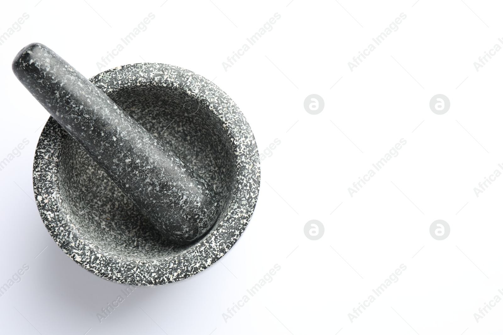 Stone mortar and pestle on white background, top view. Space for text Photo of Stone mortar and pestle on white background, top view. Space for text