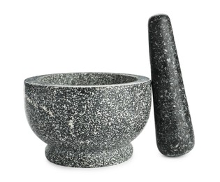 Photo of Stone mortar and pestle isolated on white