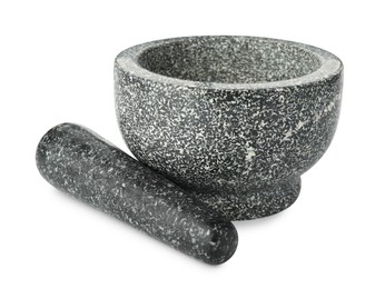 Photo of Stone mortar and pestle isolated on white