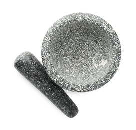 Photo of Stone mortar and pestle isolated on white, top view