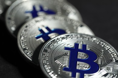 Photo of Cryptocurrency. Silver bitcoins on grey background, closeup