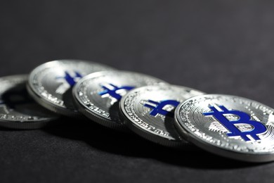 Photo of Cryptocurrency. Silver bitcoins on grey background, closeup