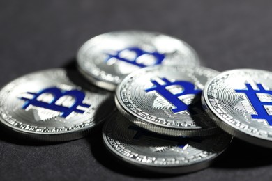 Photo of Cryptocurrency. Silver bitcoins on grey background, closeup