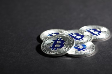 Photo of Cryptocurrency. Silver bitcoins on grey background, closeup