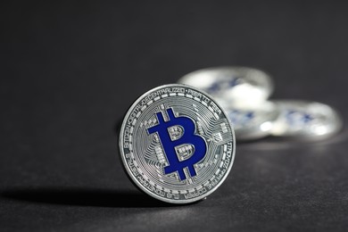 Photo of Cryptocurrency. Silver bitcoins on grey background, closeup