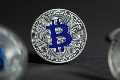 Photo of Cryptocurrency. Silver bitcoins on grey background, closeup