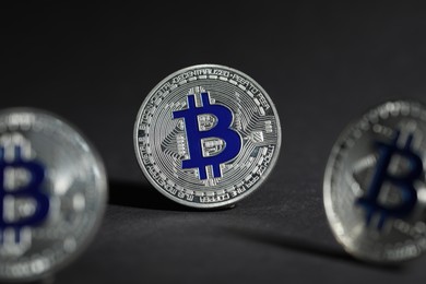 Photo of Cryptocurrency. Silver bitcoins on grey background, closeup
