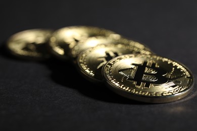 Photo of Cryptocurrency. Golden bitcoins on grey background, closeup
