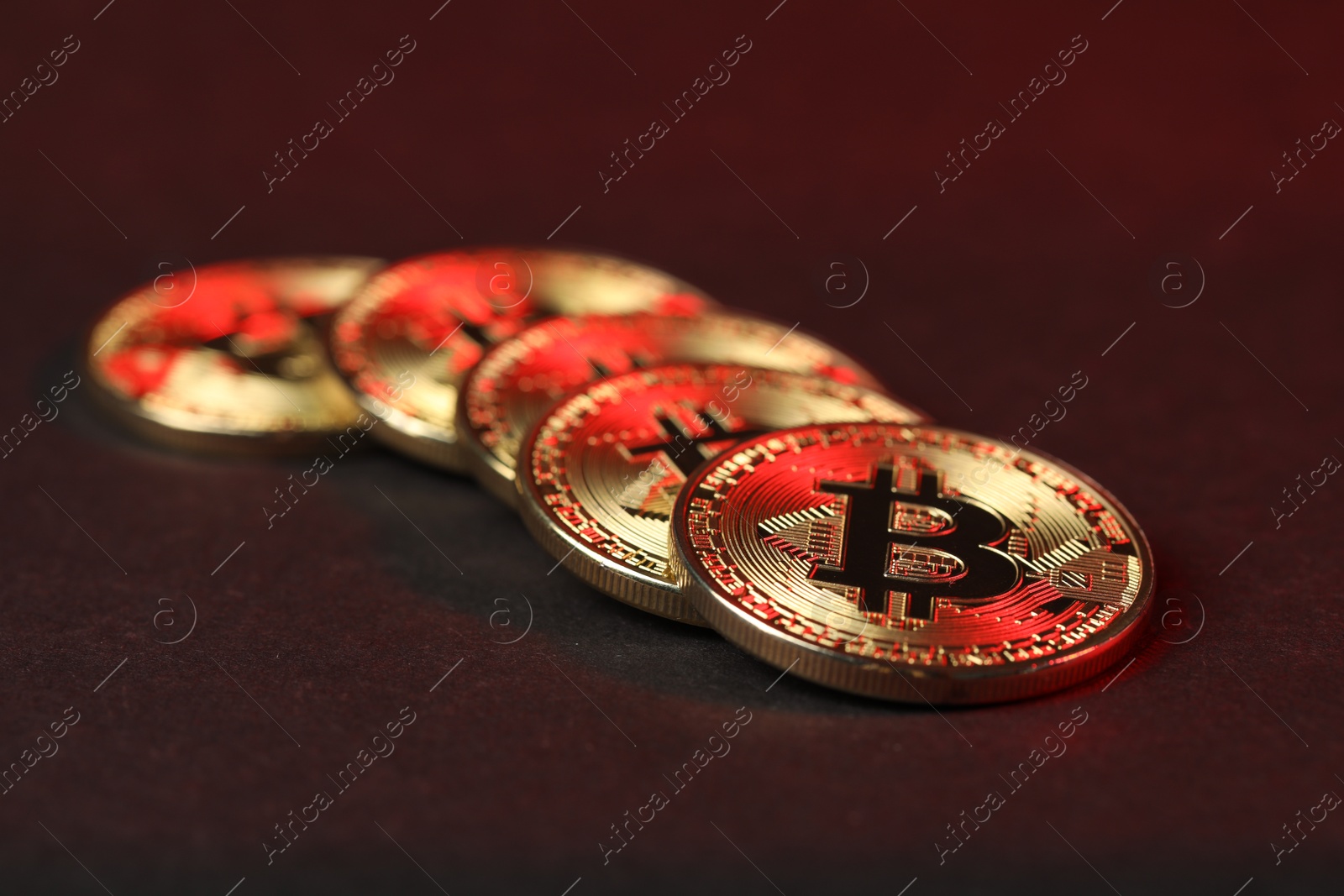 Cryptocurrency. Golden bitcoins on dark background, closeup Photo of Cryptocurrency. Golden bitcoins on dark background, closeup