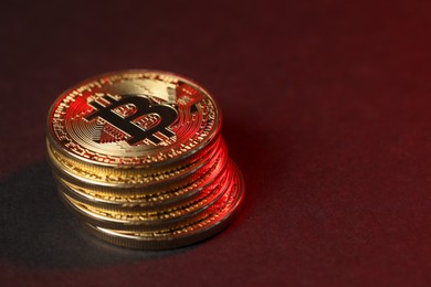 Photo of Cryptocurrency. Golden bitcoins on dark background, closeup. Space for text