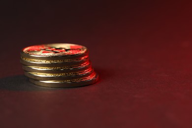 Photo of Cryptocurrency. Golden bitcoins on dark background, closeup. Space for text
