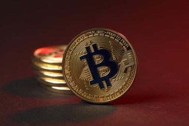 Photo of Cryptocurrency. Golden bitcoins on dark background, closeup