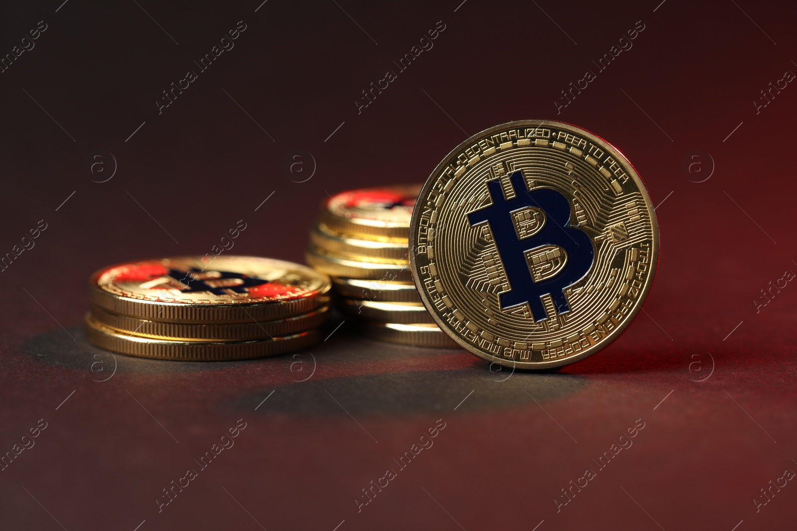 Cryptocurrency. Golden bitcoins on dark background, closeup Photo of Cryptocurrency. Golden bitcoins on dark background, closeup