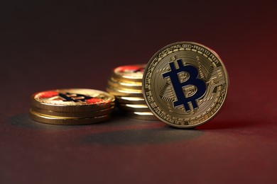 Photo of Cryptocurrency. Golden bitcoins on dark background, closeup
