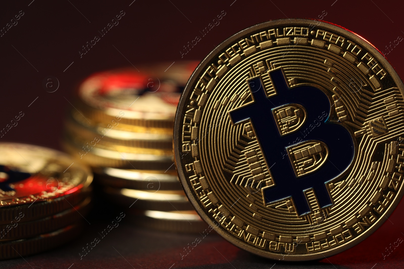 Cryptocurrency. Golden bitcoins on dark background, closeup Photo of Cryptocurrency. Golden bitcoins on dark background, closeup