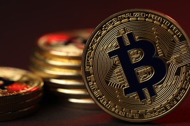Photo of Cryptocurrency. Golden bitcoins on dark background, closeup