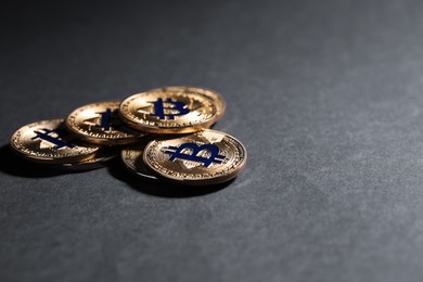 Photo of Cryptocurrency. Golden bitcoins on grey background, closeup. Space for text