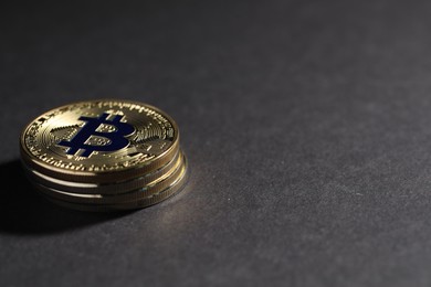 Photo of Cryptocurrency. Golden bitcoins on grey background, closeup. Space for text