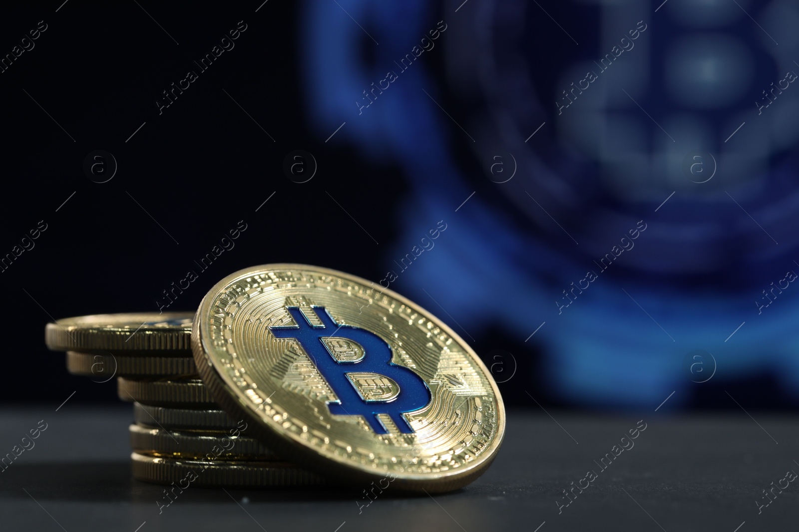 Photo of Cryptocurrency. Golden bitcoins on grey table, closeup