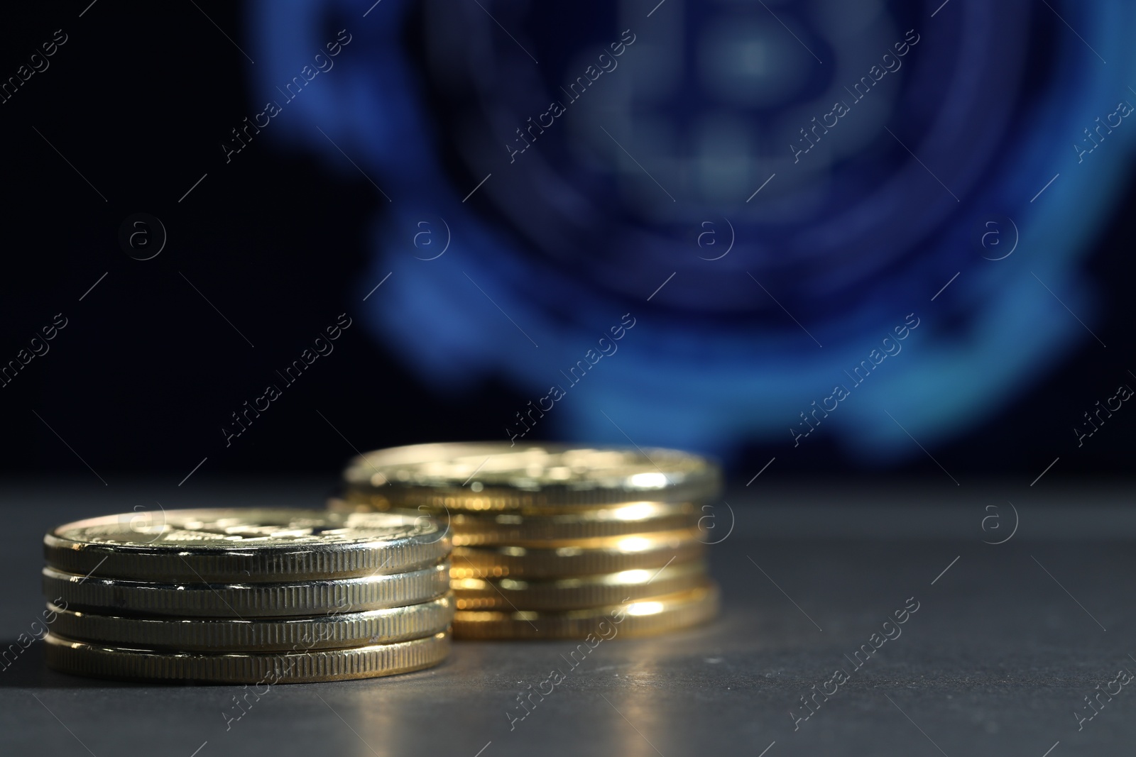 Cryptocurrency. Golden bitcoins on grey table, closeup. Space for text Photo of Cryptocurrency. Golden bitcoins on grey table, closeup. Space for text