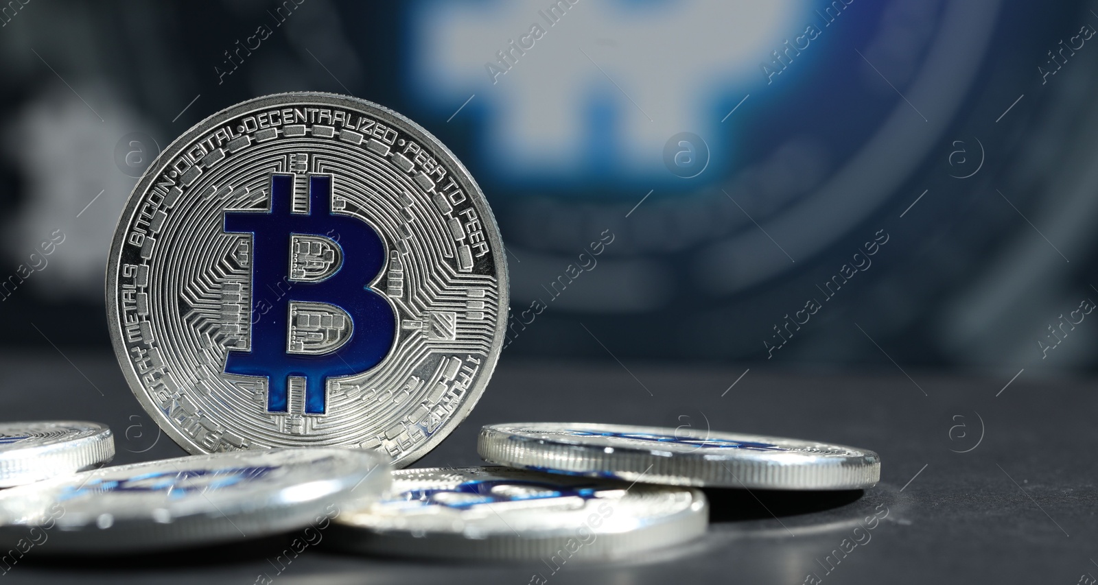 Cryptocurrency. Silver bitcoins on grey table, closeup. Space for text Photo of Cryptocurrency. Silver bitcoins on grey table, closeup. Space for text