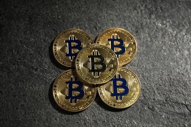 Photo of Cryptocurrency. Bitcoins on grey table, above view