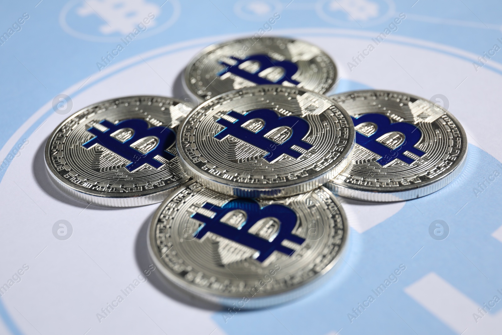 Silver bitcoins on cryptocurrency symbol, closeup view Photo of Silver bitcoins on cryptocurrency symbol, closeup view