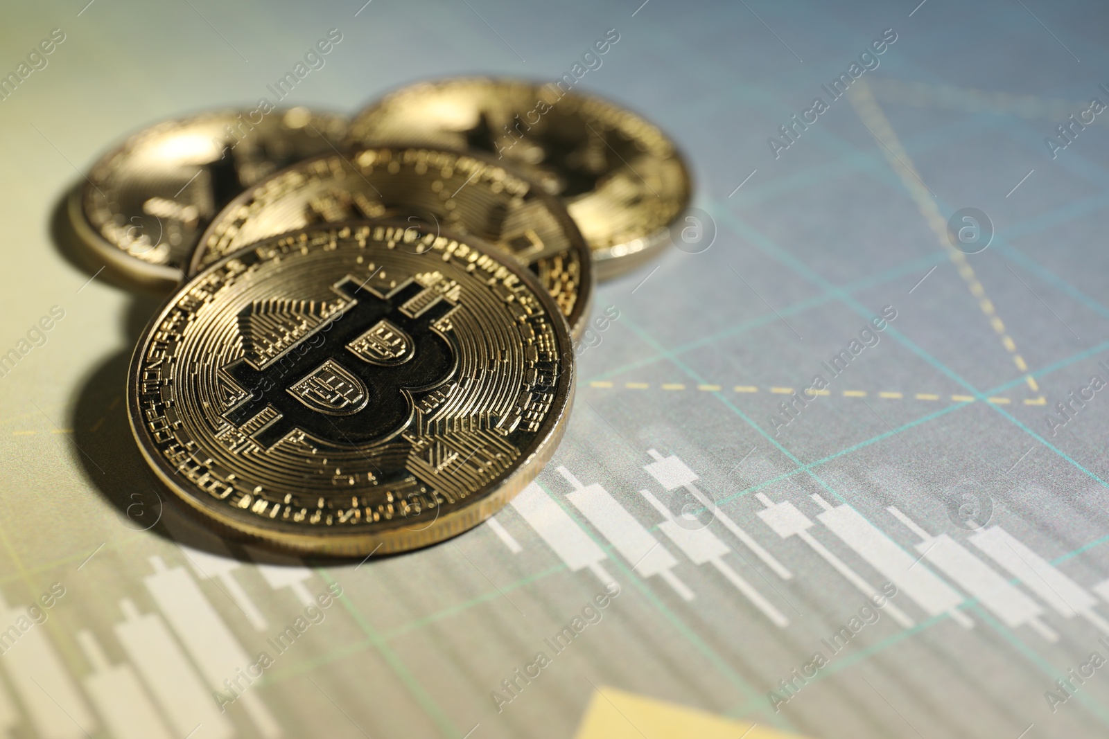 Cryptocurrency. Bitcoins on data charts, closeup. Space for text Photo of Cryptocurrency. Bitcoins on data charts, closeup. Space for text