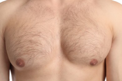 Photo of Young man with hairy chest, closeup. Epilation procedure