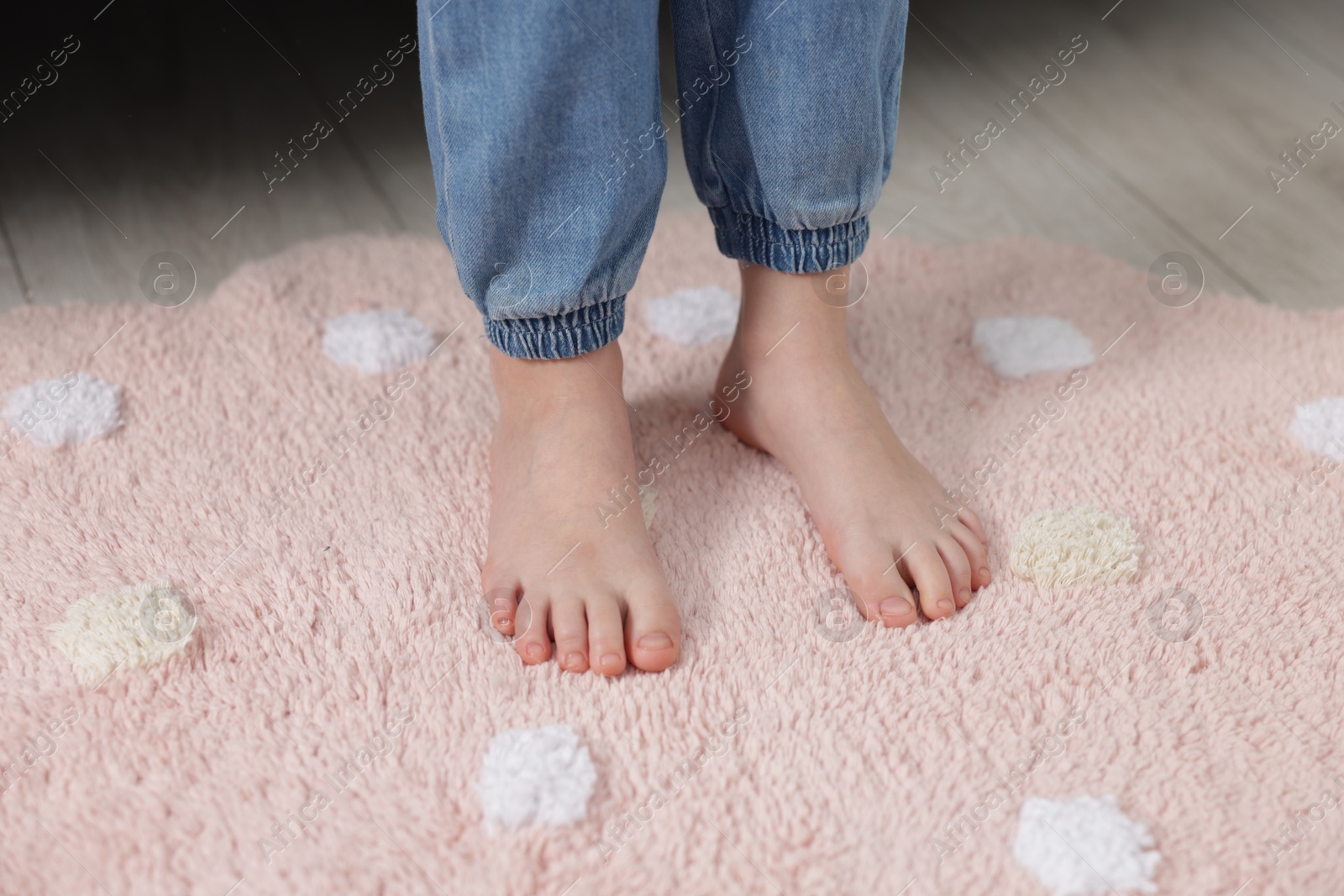 Girl on soft carpet at home, closeup Photo of Girl on soft carpet at home, closeup
