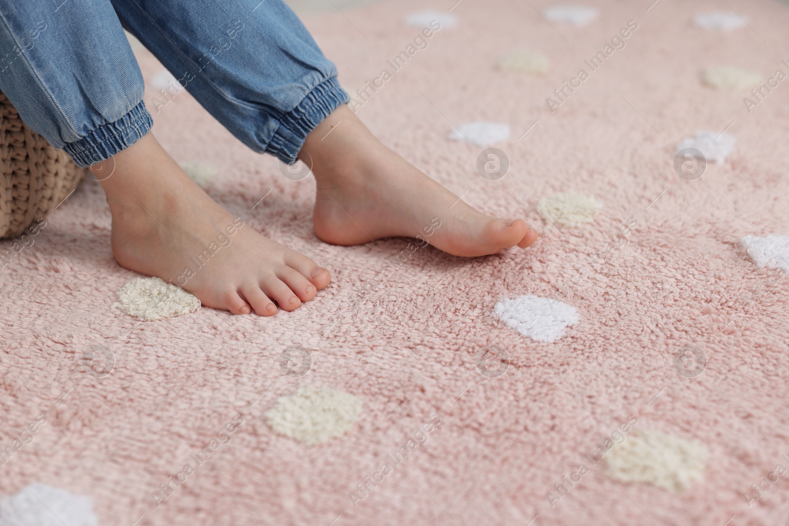 Girl on soft carpet at home, closeup Photo of Girl on soft carpet at home, closeup