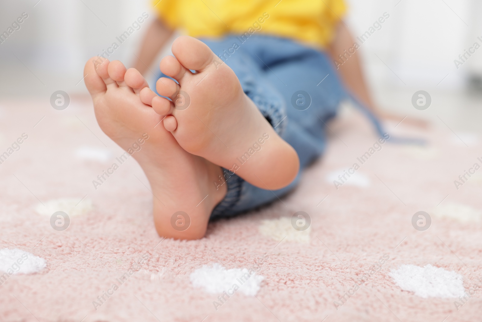 Girl on soft carpet at home, closeup Photo of Girl on soft carpet at home, closeup