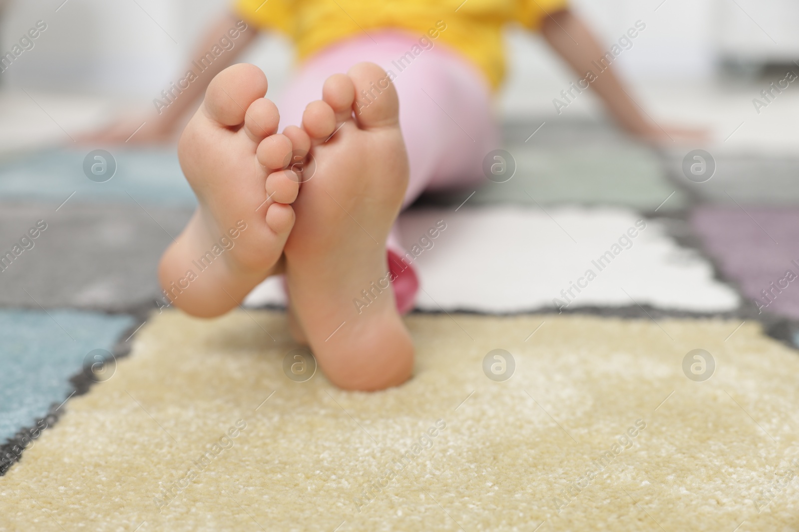 Girl on soft carpet at home, closeup Photo of Girl on soft carpet at home, closeup