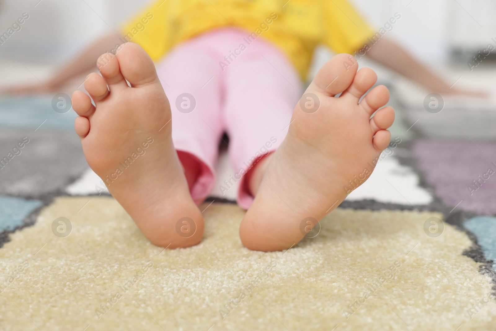Girl on soft carpet at home, closeup Photo of Girl on soft carpet at home, closeup