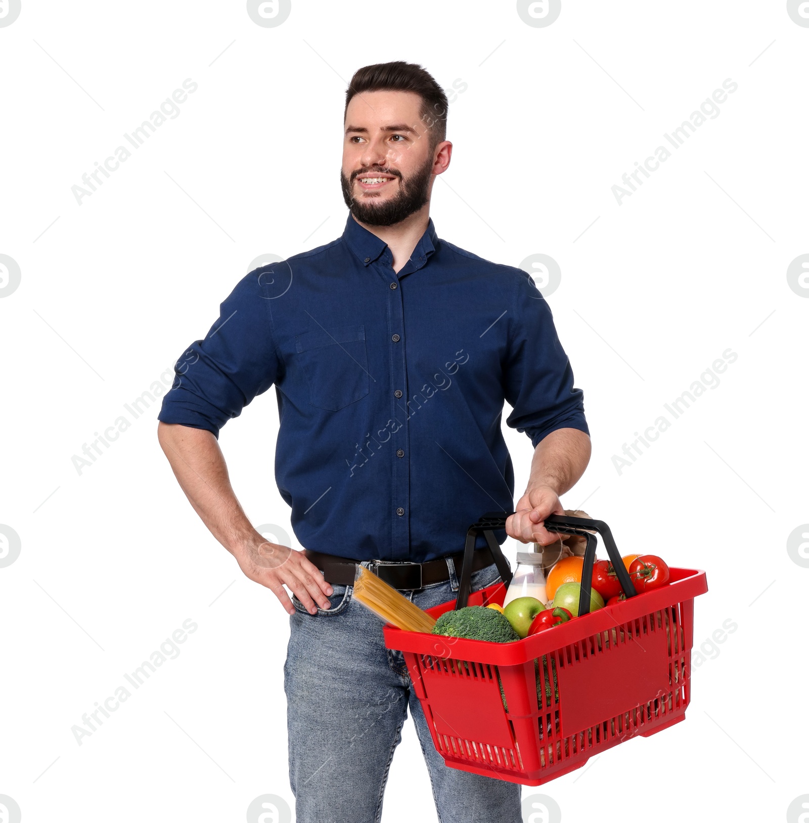 Man with shopping basket full of products on white background Photo of Man with shopping basket full of products on white background