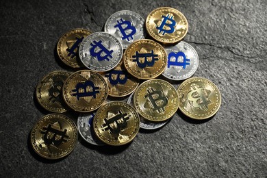 Photo of Cryptocurrency. Bitcoins on grey table, flat lay