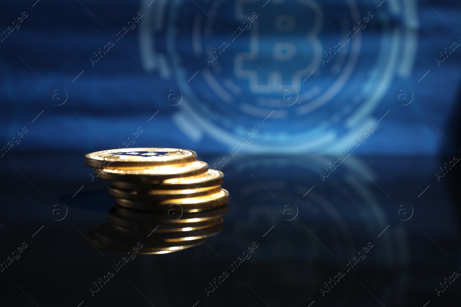 Cryptocurrency. Bitcoins on mirror surface, closeup. Space for text Photo of Cryptocurrency. Bitcoins on mirror surface, closeup. Space for text