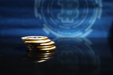 Photo of Cryptocurrency. Bitcoins on mirror surface, closeup. Space for text