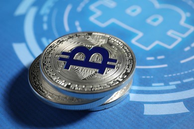 Photo of Stack of bitcoins on cryptocurrency symbol, closeup