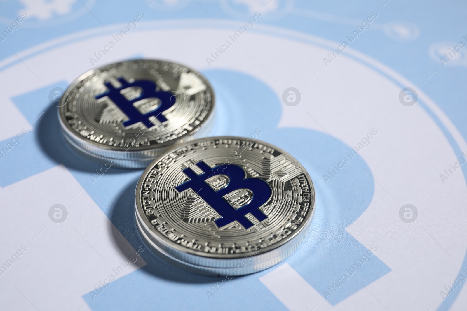 Silver bitcoins on cryptocurrency symbol, closeup view Photo of Silver bitcoins on cryptocurrency symbol, closeup view