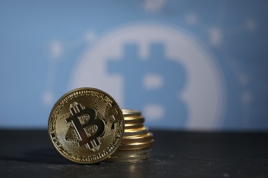 Photo of Cryptocurrency. Bitcoins on black table, closeup. Space for text