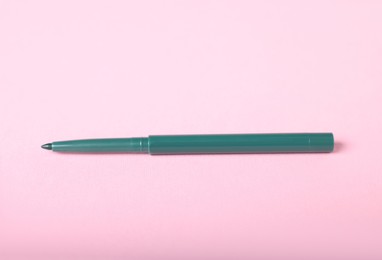 Photo of One twist up eye pencil on pink background